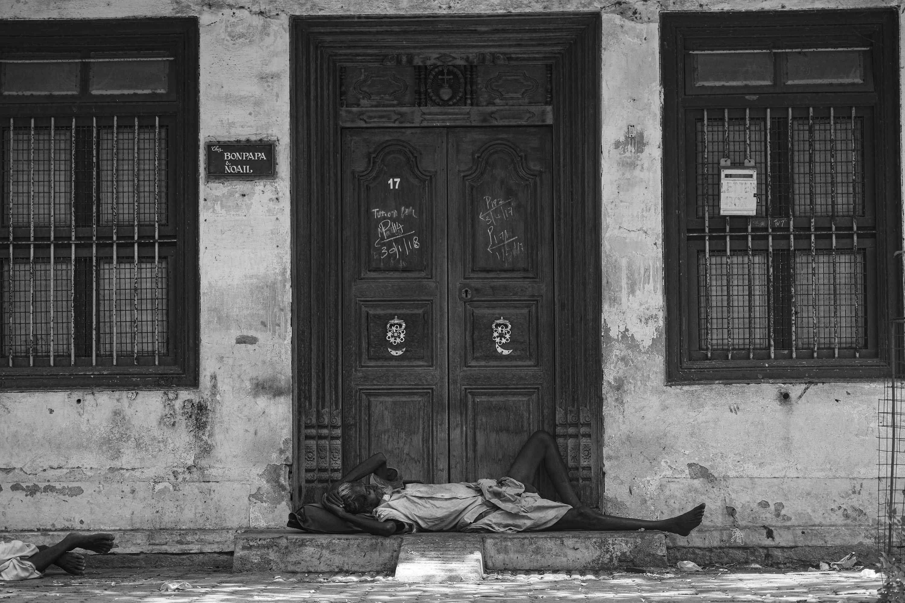 Old man by a doorway